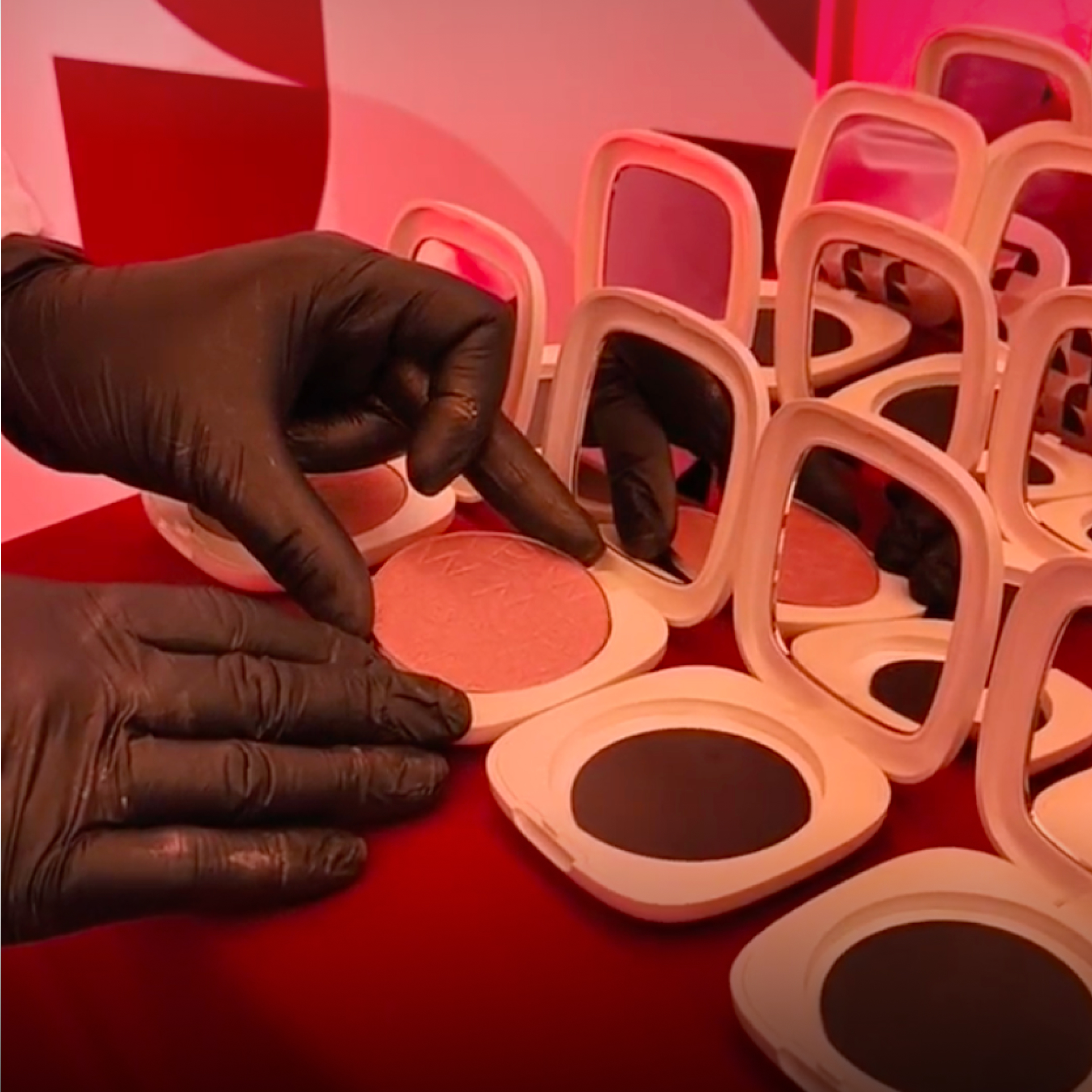 Placing pressed powder pans into Olimpia compacts